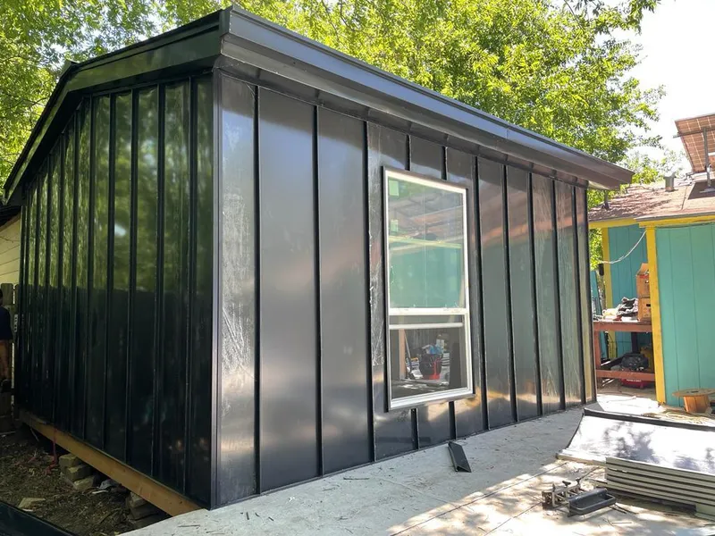 Black standing seam metal wall panels for Roof Inspection in Amarillo