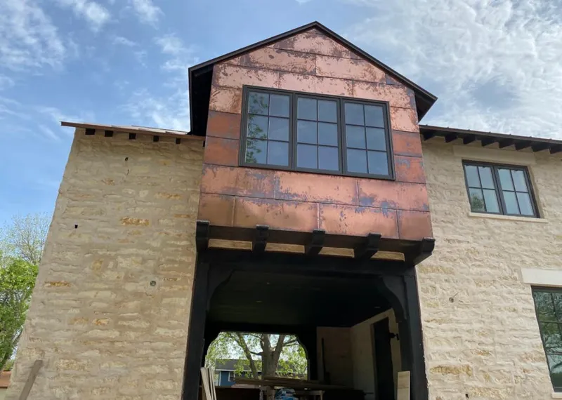 Copper metal panel facade on a stone building for Metal Roof Coating in Amarillo