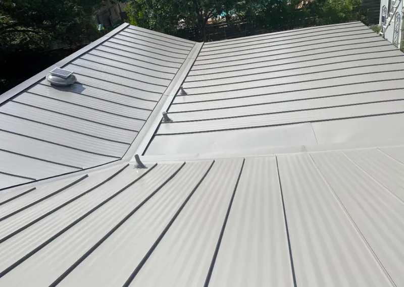 Solar attic fan installed on a metal roof for Roof Ventilation in Amarillo